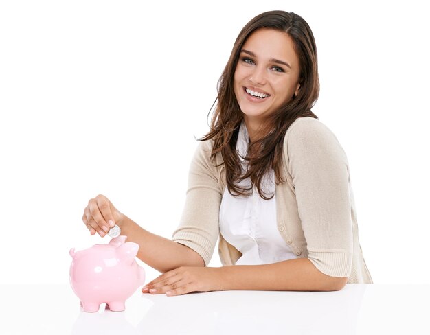 Money bank savings and portrait of woman happy about saving banking and investment for future Female with a smile isolated on a white background for budget security and coins in pig container