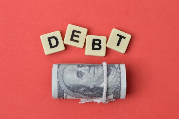 money banknote and square letters with text debt