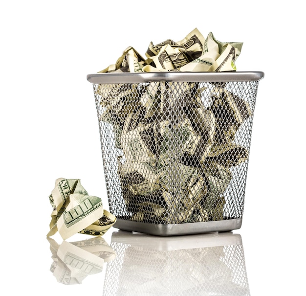 Money in a basket on a white background