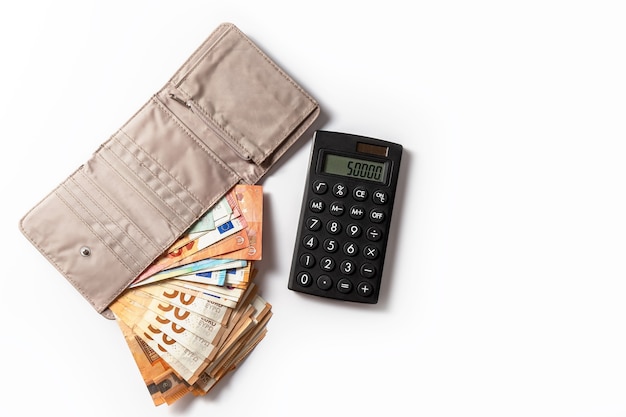 Money Cash Euro bills in the wallet and calculatoron a white background