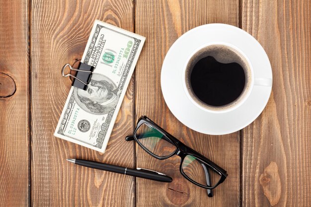 Money cash glasses pen and coffee cup