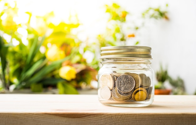 Photo money coin in glass jar.for savings financial investment concept