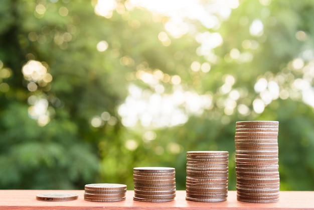  Money coin stack growing graph with green bokeh background