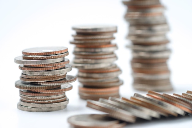 Money coins to stack of coinsSaving money for future use concept and money financial business growth concept  isolated on white background