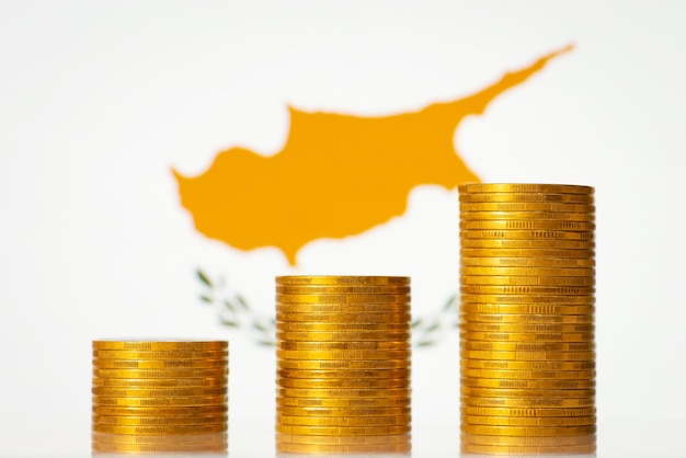 Money coins stacks in front of Cyprus flag