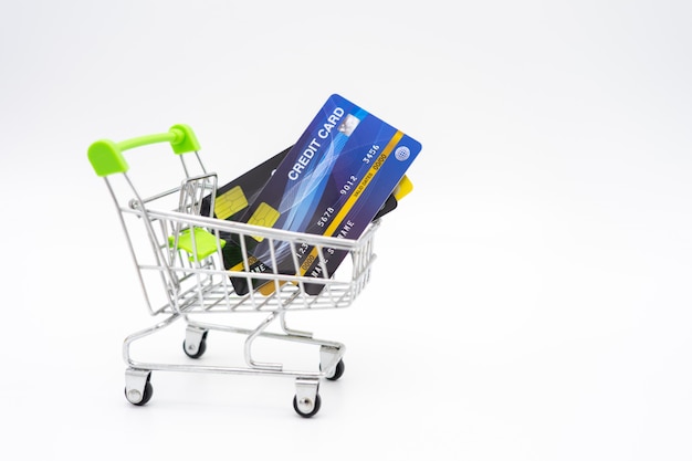 Money concept of Credit Cards in a Shopping Cart on isolate white background.  