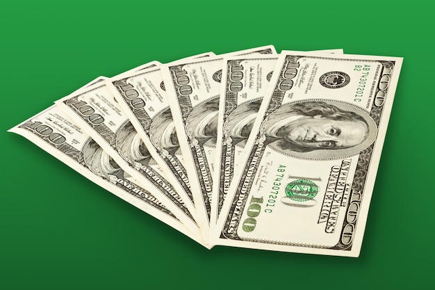 Photo money concept - several dollars banknotes over green