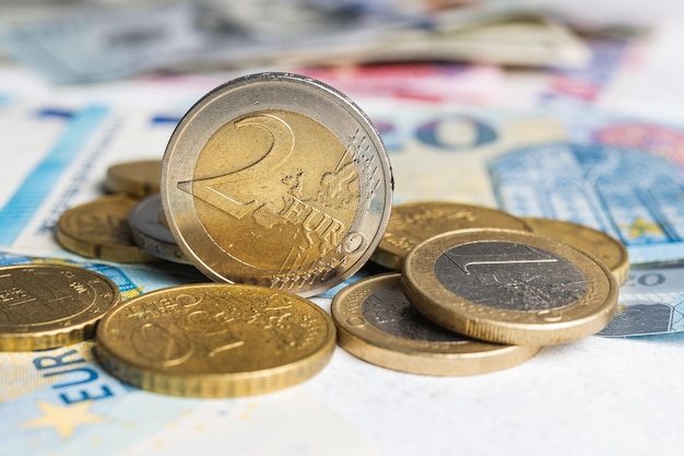 Money, euro coins and paper banknotes, close-up view.