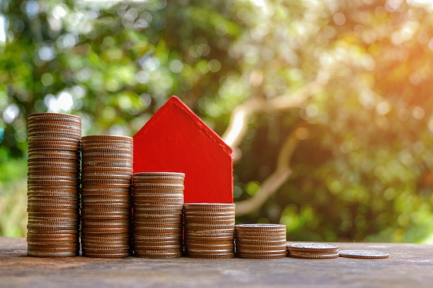 Money growth coins Stacks on wooden table - Concept of finance investment.