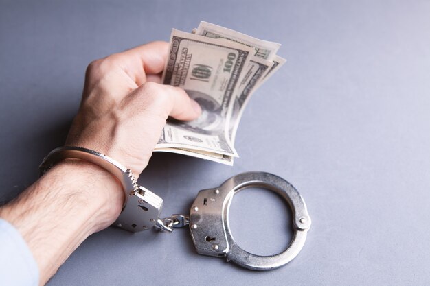 Money and handcuffs bribery of the authorities