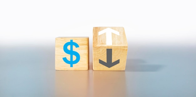 Money icon and arrow on wooden box light gray backgroundexchange rate and currency financial business