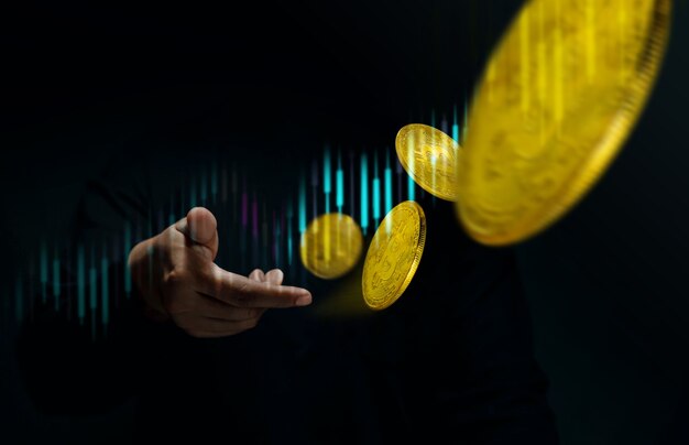 Money Investment on Crypto Currency Coin Concept. Golden Bitcoin Floating over a Trader Hand. Stock Market Graph