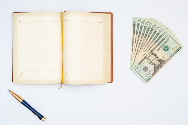 Photo money notebook and pen with white background isolated