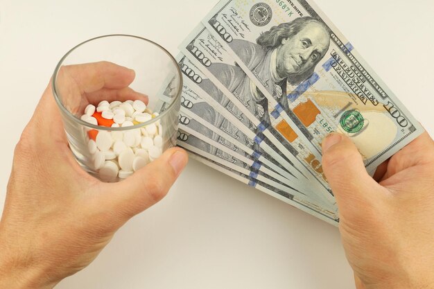 Money and pills in hands