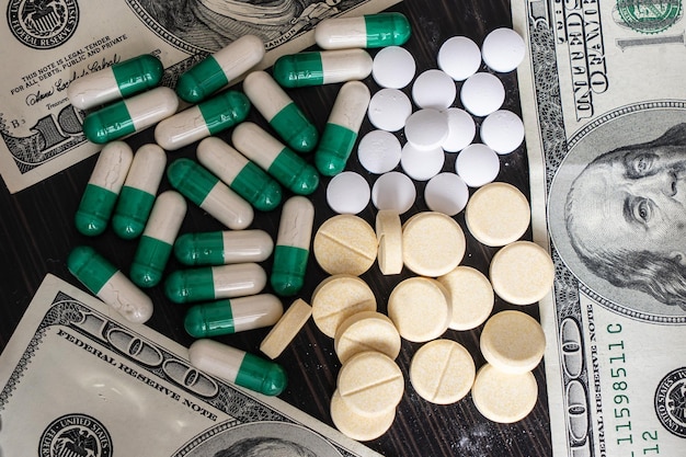 Photo money and pills, health pill tablet cash and dollar capsule pharmaceutical