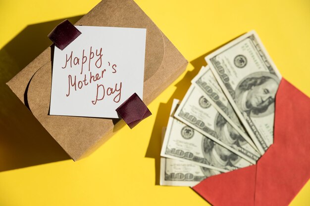 Money in red envelopes Happy mothers day greeting gift closed up of pile of US dollar banknotesBanknotes folded in an envelope as a present Sending or saving money corruption concept