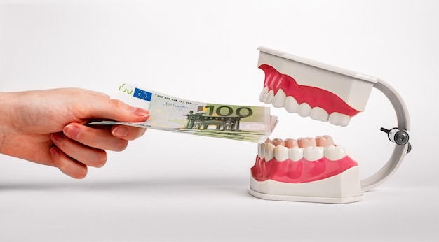 Photo money for teeth health tooth healthcare dental treatment dentistry service in euro