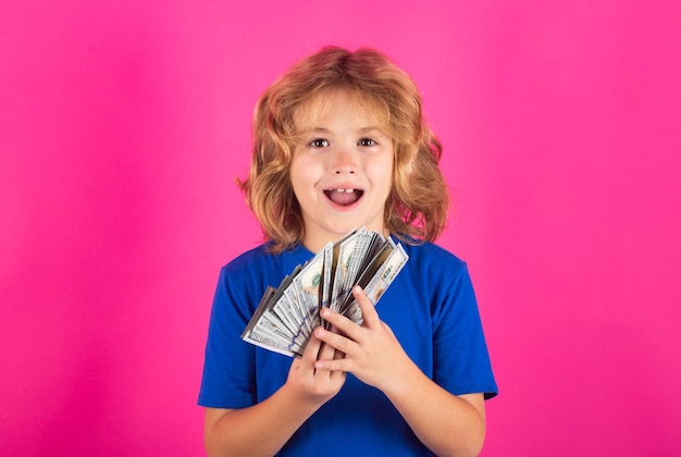 Money win big luck Child with money dollar bills standing dreamy of rich against isolated studio background