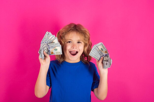 Money win big luck Studio portrait of child with money banknotes Kid with money for future Children