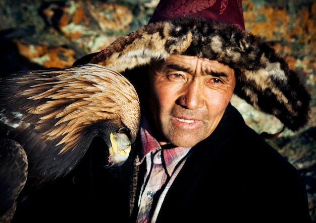 Mongolian man on a horse with an eagle