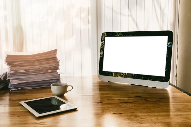 Photo monitor and office supplies on office desk.