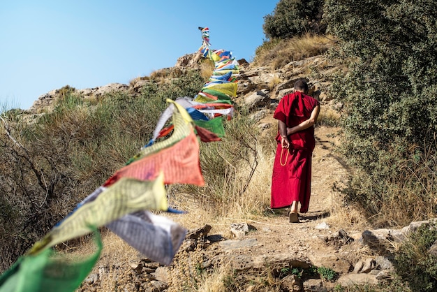 A monk walking and praying in a Buddhist temple in the Alpujarras of Granada, Spain