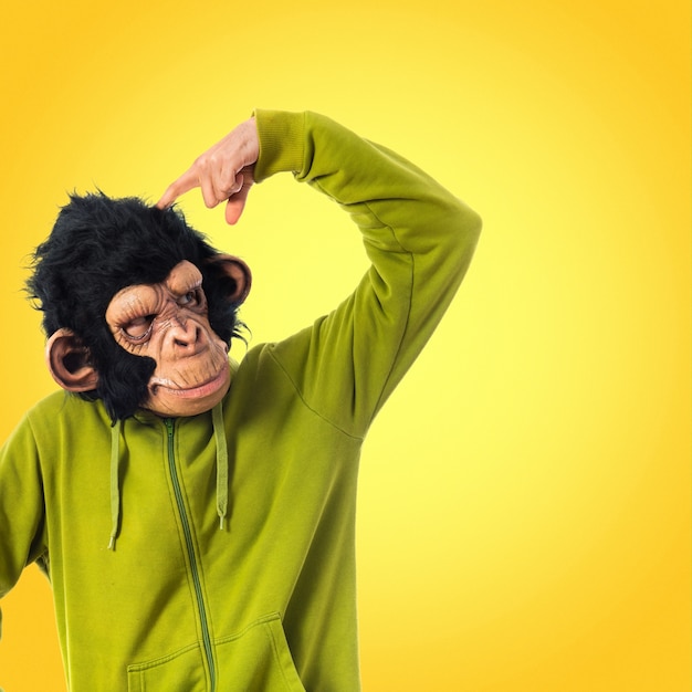 Monkey man thinking over white background   on colorful background