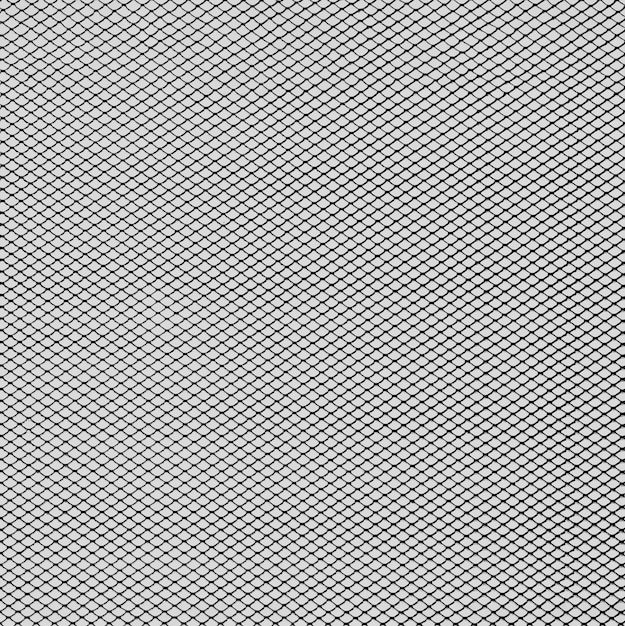 Monochrome metal grid background with black dot pattern