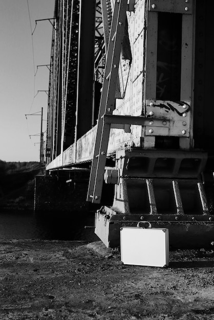 Monochrome photo of a silver metal case with money transfer concept