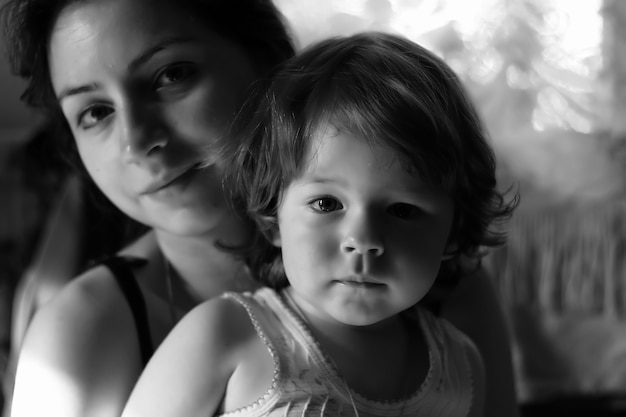 Monochrome portrait son with mother