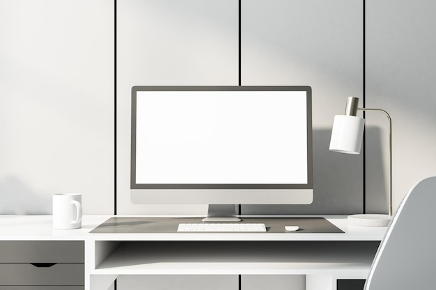 Monochrome style home workplace with blank white computer monitor on white table at light wall background Mock up
