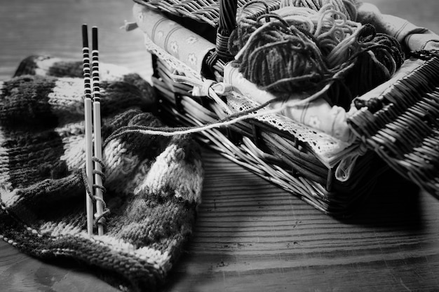 Monochrome wool and knitting needles