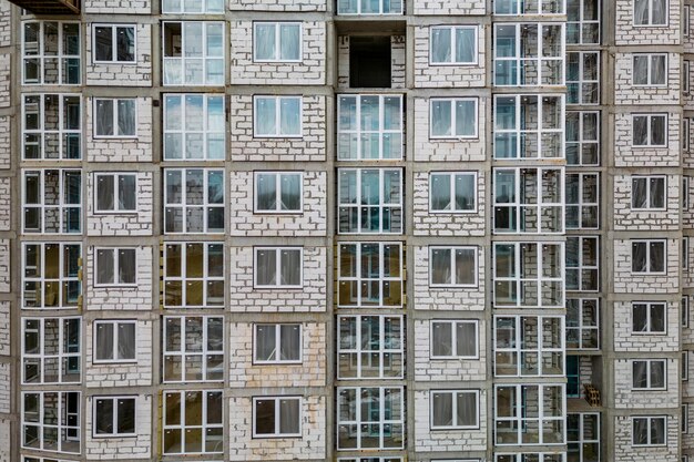 Monolithic frame construction of the building Family mortgage Shooting from a drone Modern construction of a residential building construction site close up Multistorey building