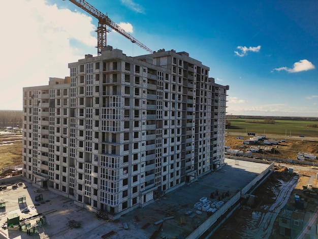 Monolithic frame construction of the building solid walls of\
concrete shooting from a drone modern construction of a residential\
building construction site close up