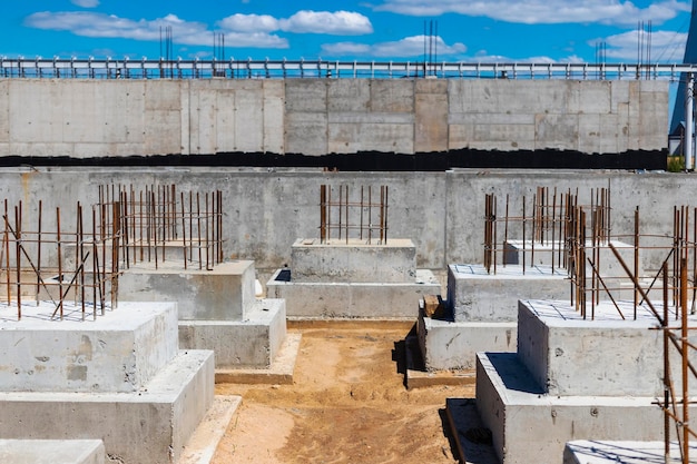 Monolithic reinforced concrete foundations for the construction of a residential building Grillage at the construction site Construction pit with foundations