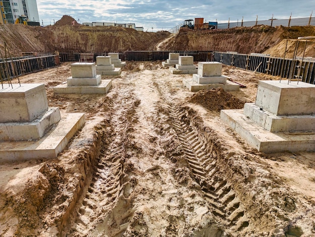 Monolithic reinforced concrete foundations or grillages for the construction of a large modern residential building Rostverk at the construction site Foundation for the building View from above