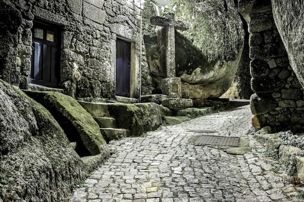 Monsanto historical village in Portugal Narrow street at night leading to the castle