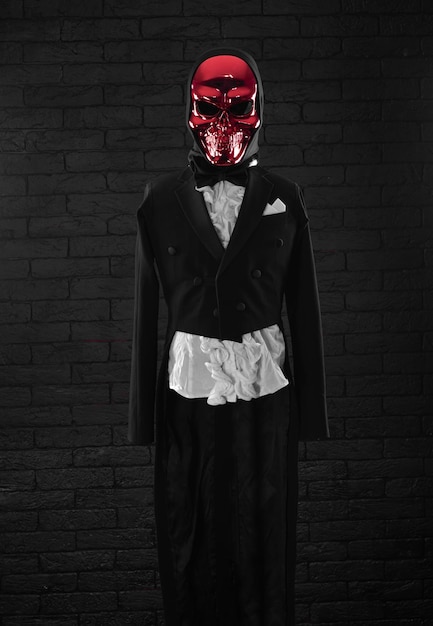 Photo monster in a tailcoat on a black background