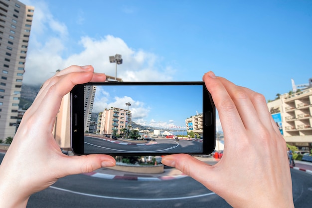 Monte Carlo, Monaco. Circuit De Monaco Is A Street Road F1 Passing Through City Streets. . Tourist Takes A Photo