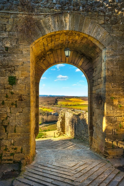 Monteriggioni medieval fortified village gateway and via francigena route Siena Tuscany Italy