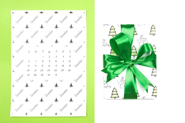 Monthly December calendar on bright colorful background. December paper calendar