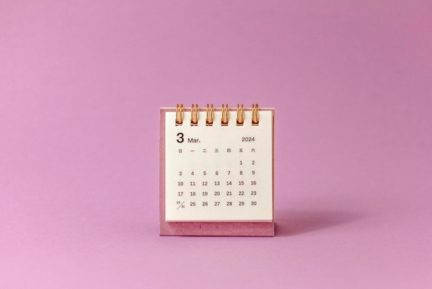 Photo the monthly desktop calendar for 2024 on a pink background