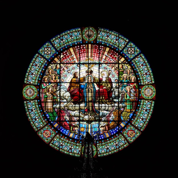 Montserrat, Spain - April 5, 2019: Stained-glass window in Benedictine Abbey of Santa Maria de Montserrat founded in 1025.