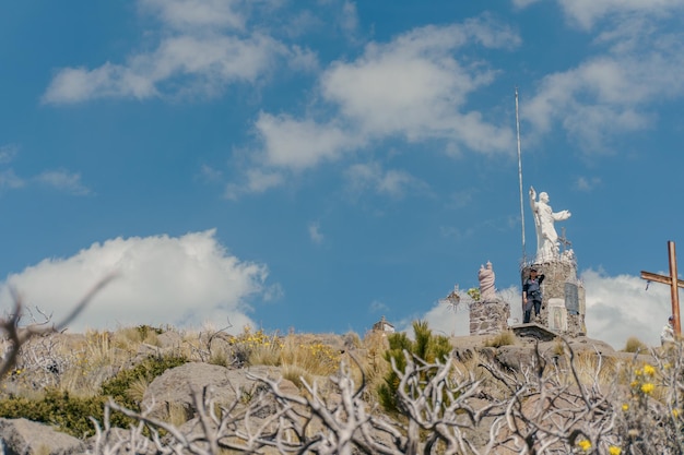 Monument to Christ the King on top of the Volcano Telapon in Rio Frio