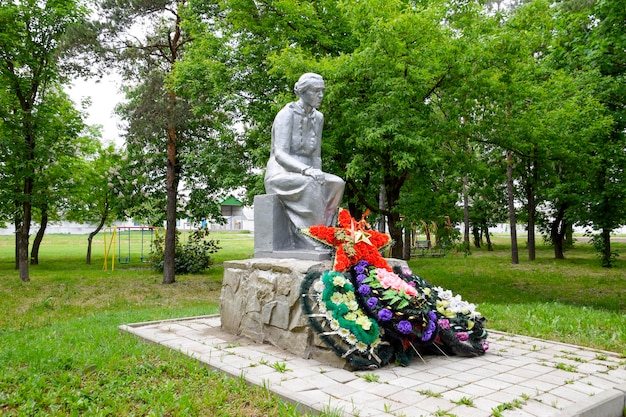 Monument to the Mother of a Soldier waiting for her son from the war Sculpture of an unknown author in the park of the village of Pervomaisky Krasnodar Krai Russia