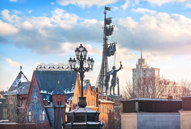 Monument to Peter the Great and Pertsova's tenement house in Moscow on a sunny winter day