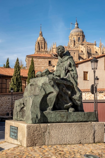 Monument to San Juan de la Cruz and in the background the cathedral of Salamanca