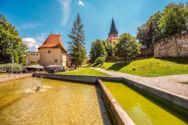 Monumental church of st aegidius in bardejov old city center\
with park bardejov slovakia slovakia unesco old city ancient\
medieval historical square bardejov