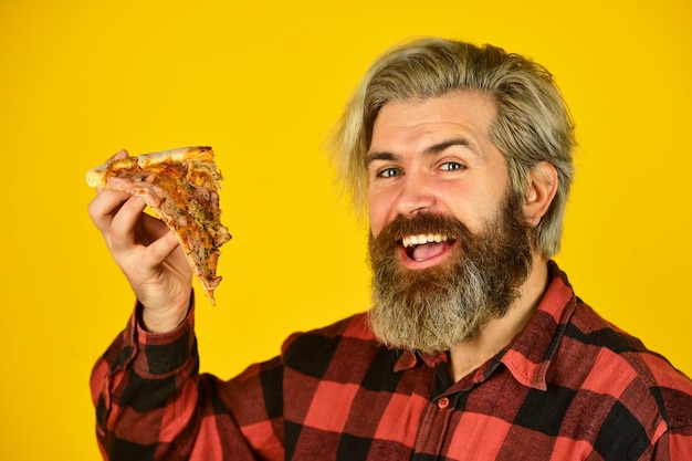 In mood for italian food man bearded hipster hold pizza pizza delivery service delivering food to apartment hungry man going to eat pizza alone cheesy taste love at first slice fresh and hot