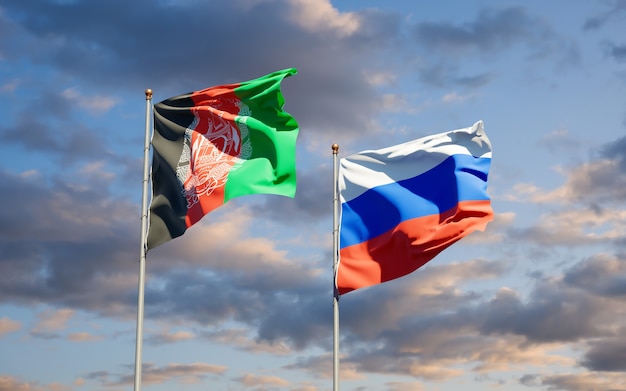 Mooie nationale vlaggen van Rusland en Afghanistan samen op blauwe hemel. 3D-illustraties